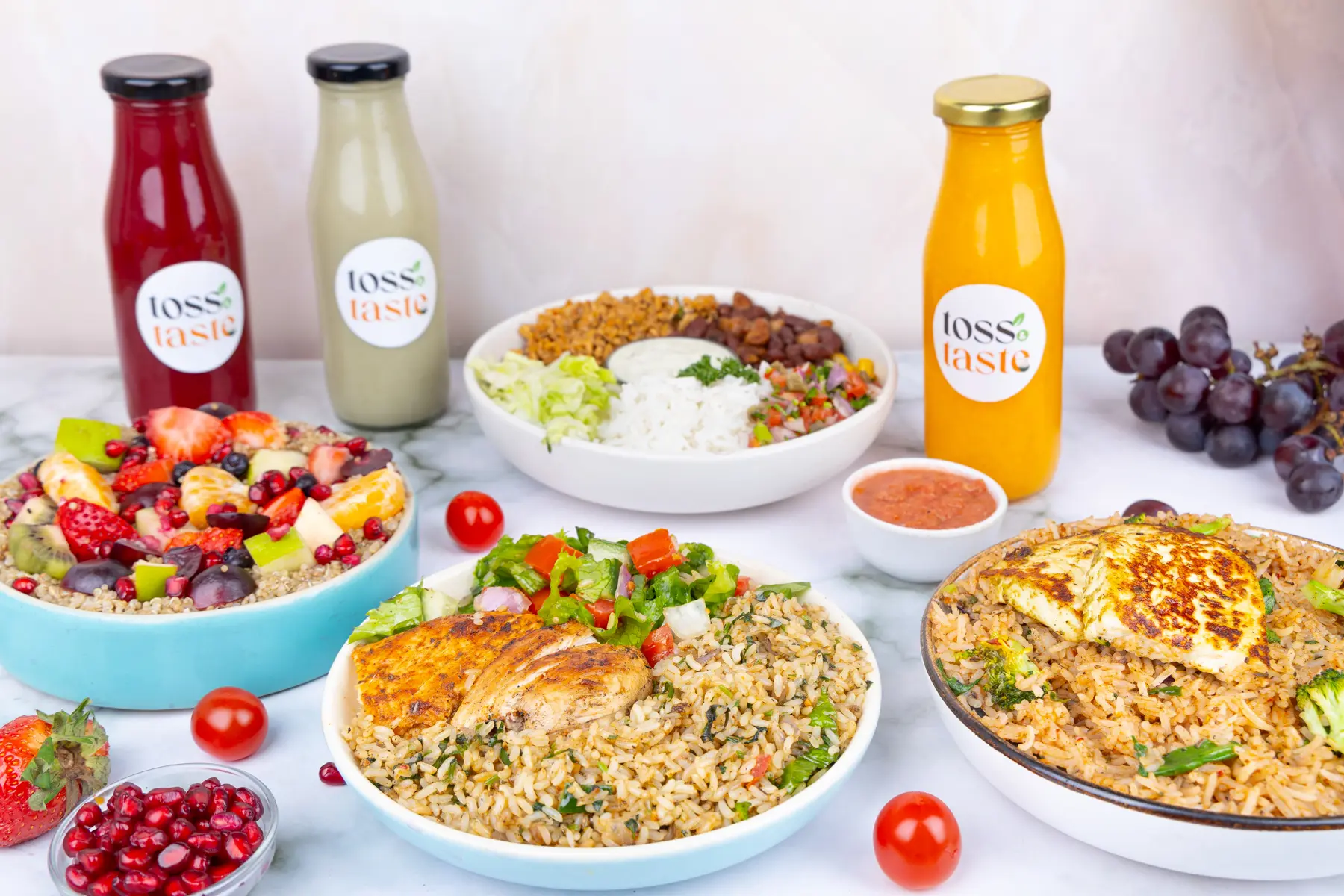 A spread of Toss & Taste salads and bowls